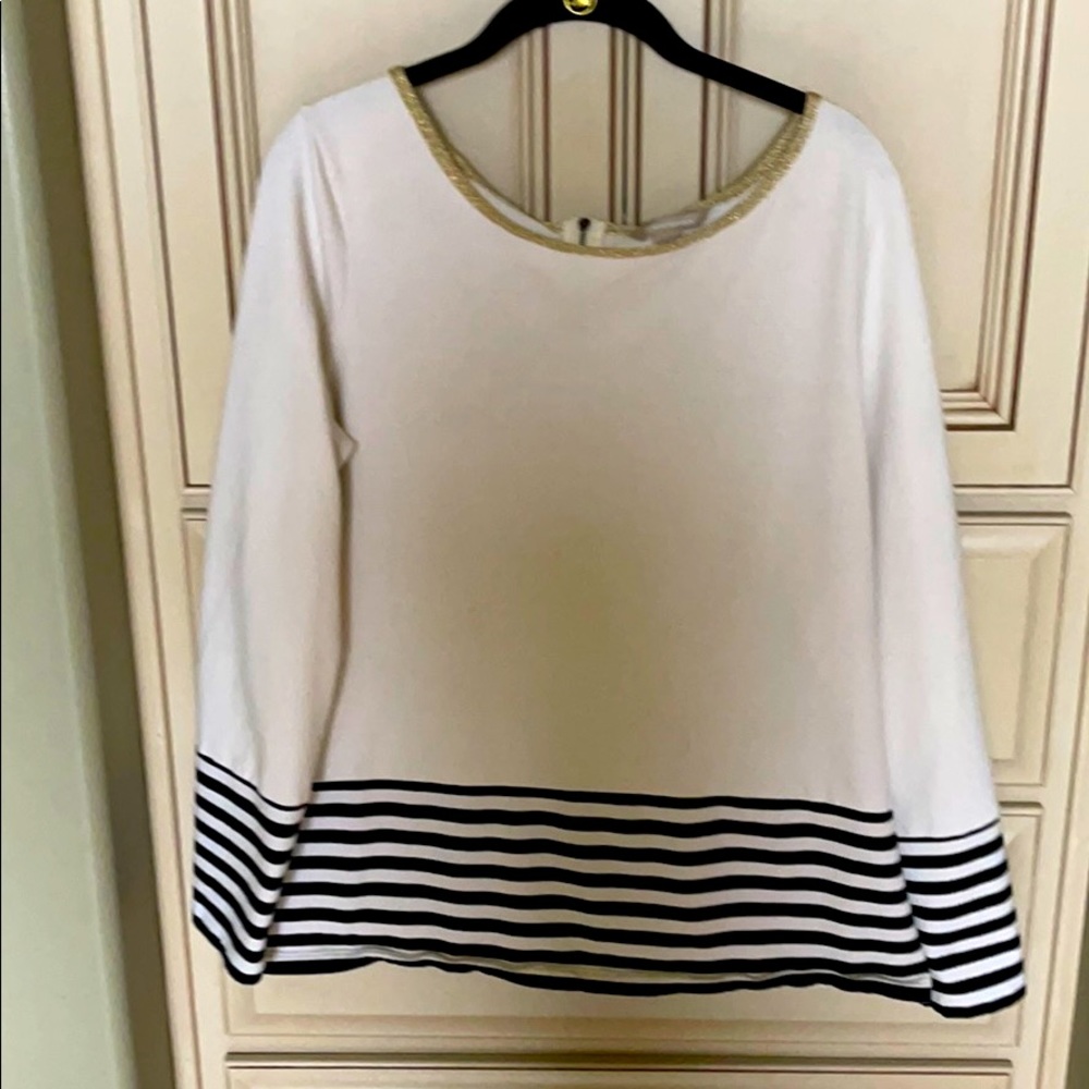 Cream blouse with B/W stripes at bottom.